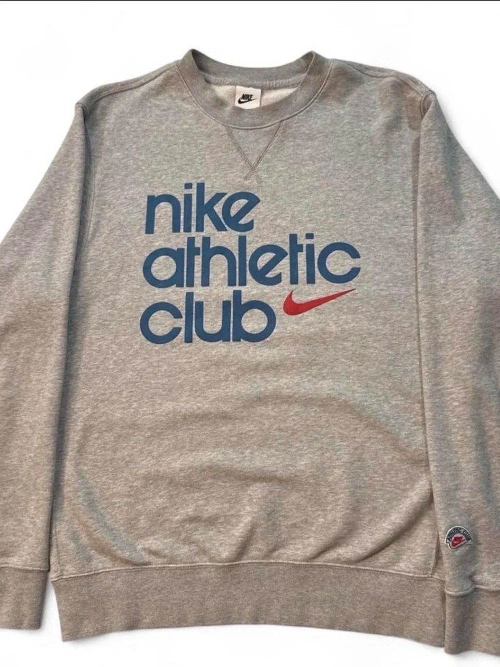 Nike Gray Crewneck Sweatshirt with Blue 'Nike Athletic Club' Logo and Red Swoosh